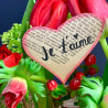 Arrangement de tulipes et fleurs printanières, dans récipient duo symbolique. Des Lys & Délices, Fleuriste à Sion